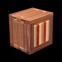 Karakuri box: Let's get dressed - Side view from below - Different wood stripes (green, red, white) - Designer: Shou Sugimoto