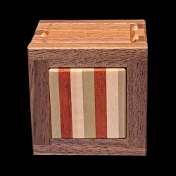 Karakuri box: Let's get dressed - View from below - Different wood stripes (green, red, white) - Designer: Shou Sugimoto