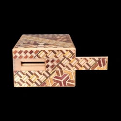 Himitsu-bako: 4 Sun 12 Steps Money Box – Front view of the coin slot – Manufacturer: Izumiya