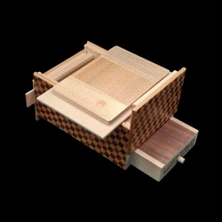 Himitsu-bako: 5 Sun 10 Steps with Drawer – Aerial view of the open box with signature on the back of the lid – Designer: H. Oka