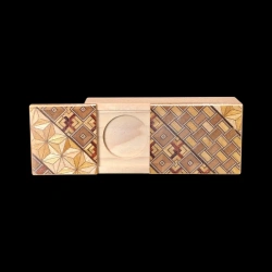 Karakuri Magic Box: Top featuring traditional Koyosegi patterns – View of the open box with a slot for a coin